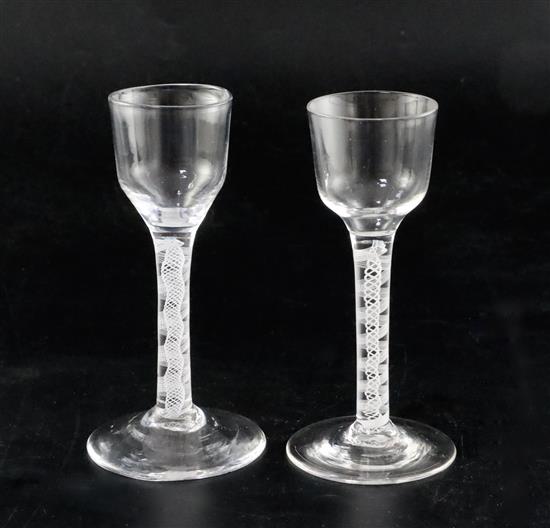 Two double series opaque twist stem cordial glasses, c.1760, H. 13.7cm